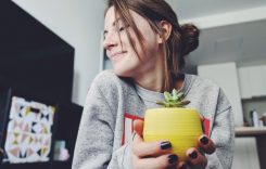 photo-of-woman-holding-a-plant-2702399